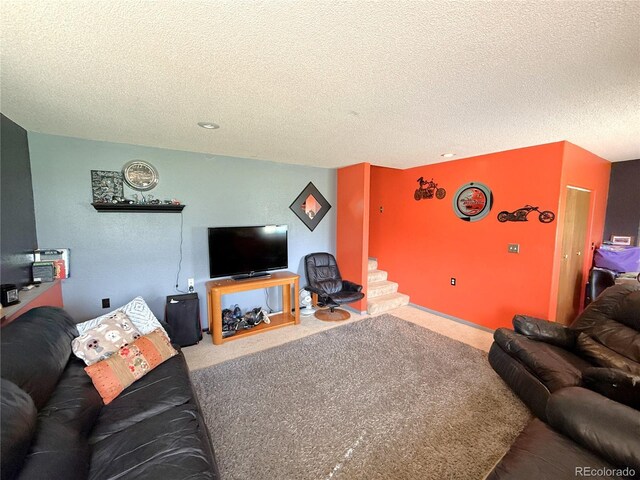 329 6th St, Hugo, CO 80821 - carpeted living room featuring a textured ceiling and stairs