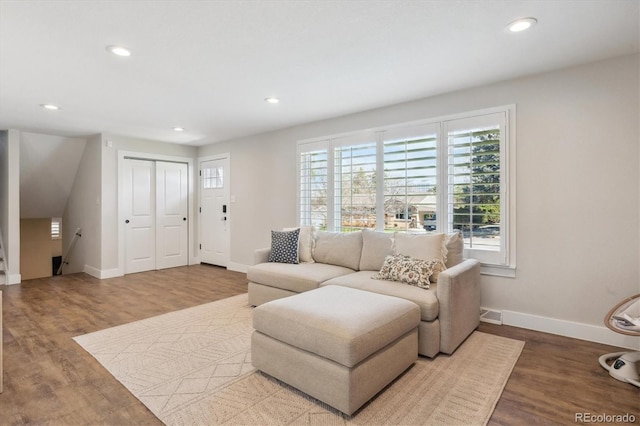 8242 E Briarwood Pl, Centennial, CO 80112 - living area with baseboards, recessed lighting, and wood finished floors