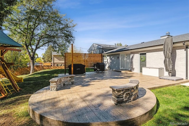8242 E Briarwood Pl, Centennial, CO 80112 - view of patio / terrace featuring an outdoor fire pit