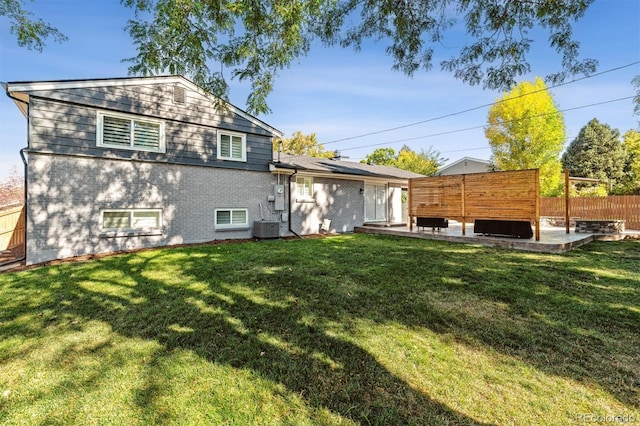 8242 E Briarwood Pl, Centennial, CO 80112 - back of property with a patio area, cooling unit, and brick siding