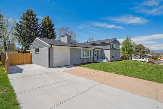 8242 E Briarwood Pl, Centennial, CO 80112 - tri-level home featuring an attached garage, a chimney, concrete driveway, and brick siding