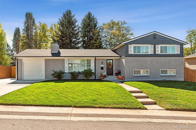 8242 E Briarwood Pl, Centennial, CO 80112 - split level home featuring an attached garage, concrete driveway, a chimney, and brick siding