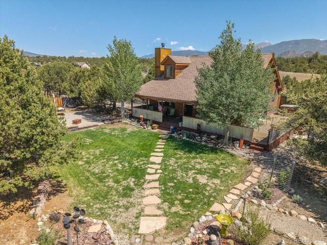 15700 County Road 352, Buena Vista, CO 81211 - view of green lawn featuring a mountain view and a porch