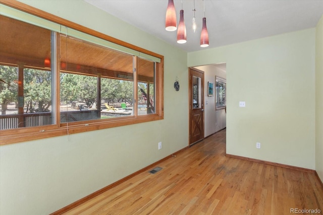 15700 County Road 352, Buena Vista, CO 81211 - spare room featuring a chandelier and wood finished floors
