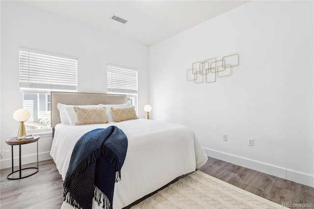 bedroom featuring hardwood / wood-style floors