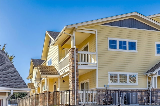 view of side of property featuring a balcony