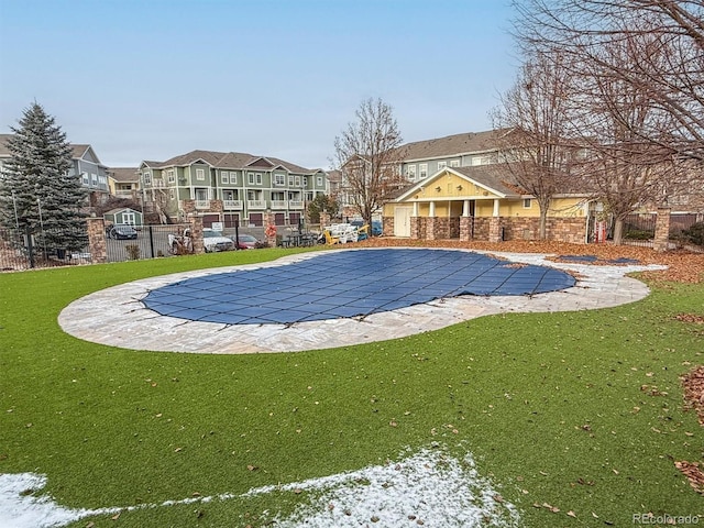 view of swimming pool featuring a patio area and a lawn