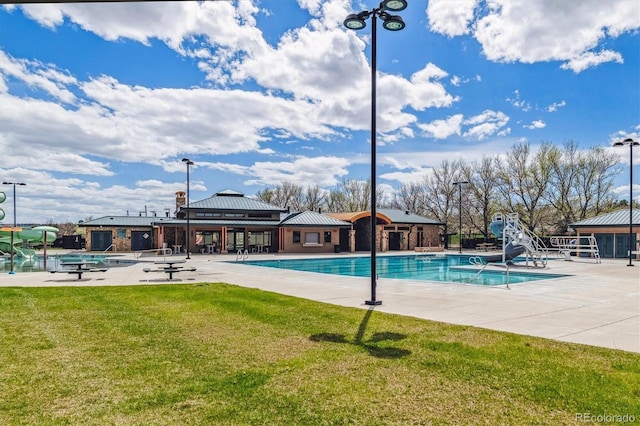9471 Ashbury Cir Unit 202, Parker, CO 80134 - community pool with a water slide and a patio area