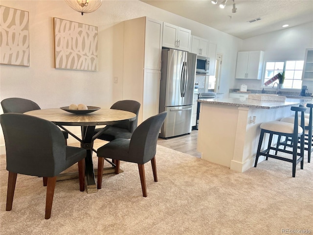 9471 Ashbury Cir Unit 202, Parker, CO 80134 - dining space with light colored carpet