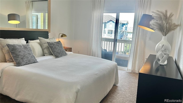 9471 Ashbury Cir Unit 202, Parker, CO 80134 - bedroom featuring access to outside and carpet