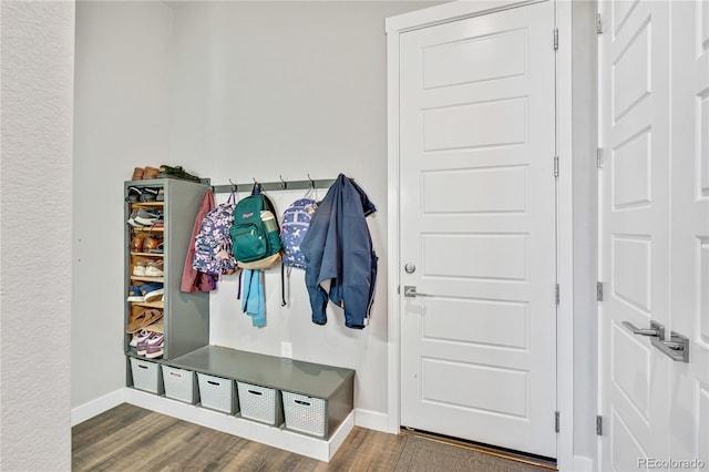 mudroom featuring baseboards and wood finished floors
