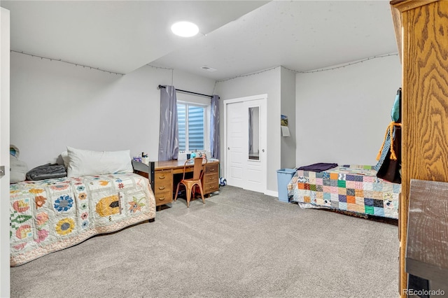 carpeted bedroom featuring visible vents