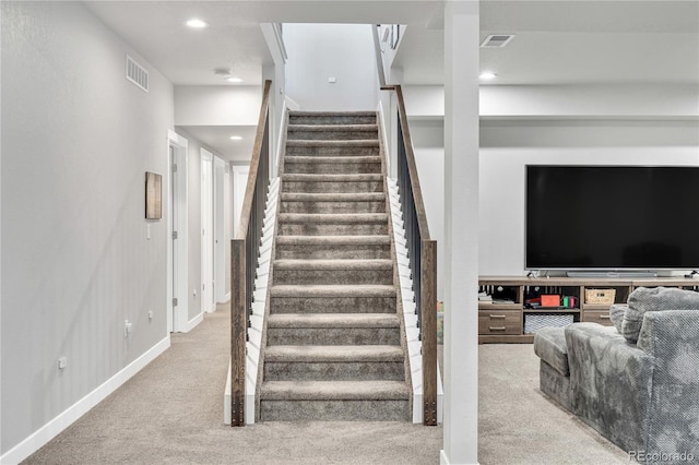 stairs with carpet, visible vents, and recessed lighting