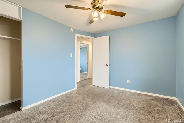 unfurnished bedroom with baseboards, a ceiling fan, and carpet flooring