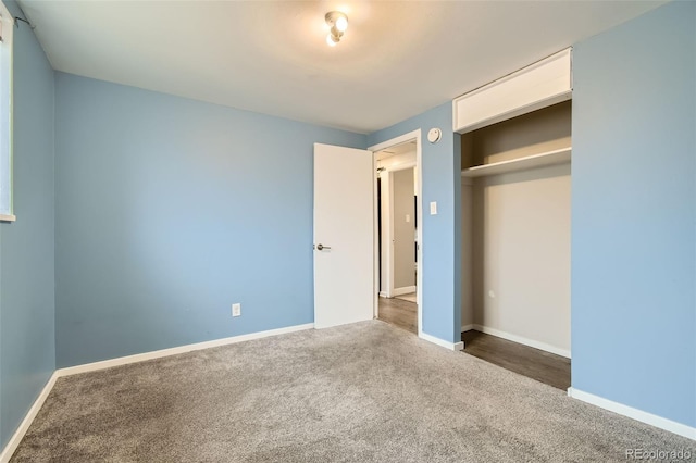 unfurnished bedroom with baseboards and carpet floors