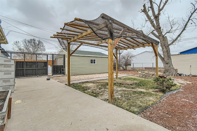 view of yard with fence, a pergola, and a gate