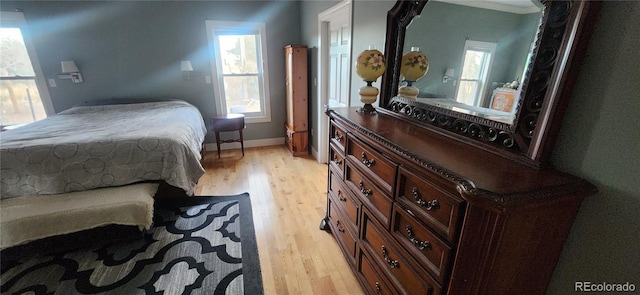 bedroom with light hardwood / wood-style floors