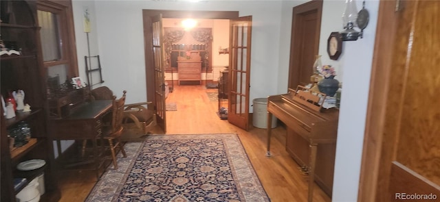 corridor with light hardwood / wood-style flooring