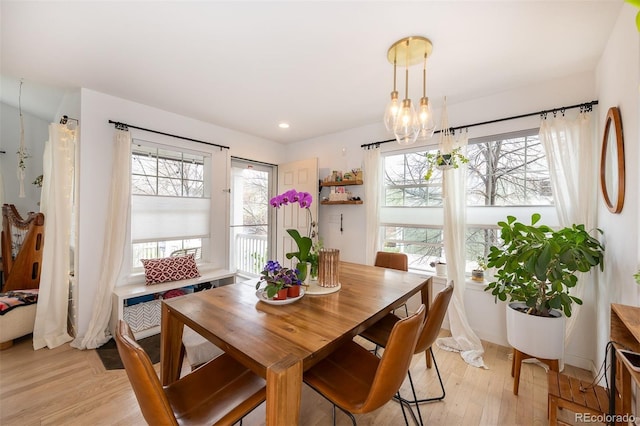 661 Snowberry St, Longmont, CO 80503 - dining area with recessed lighting, a notable chandelier, light wood finished floors, and plenty of natural light