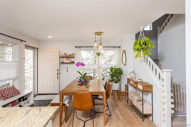 661 Snowberry St, Longmont, CO 80503 - dining area featuring recessed lighting, stairs, and light wood-type flooring