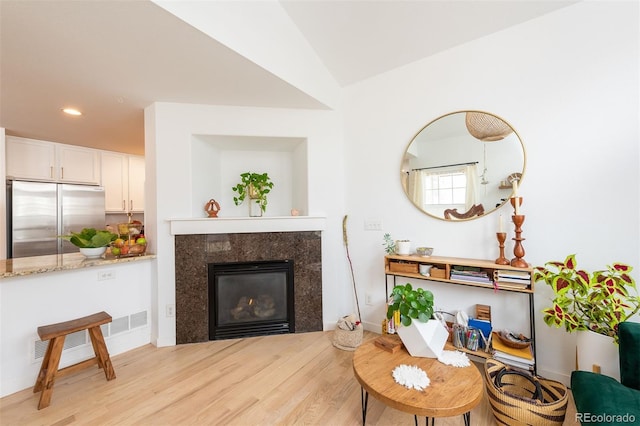 661 Snowberry St, Longmont, CO 80503 - sitting room with light wood-style floors, a premium fireplace, baseboards, visible vents, and recessed lighting
