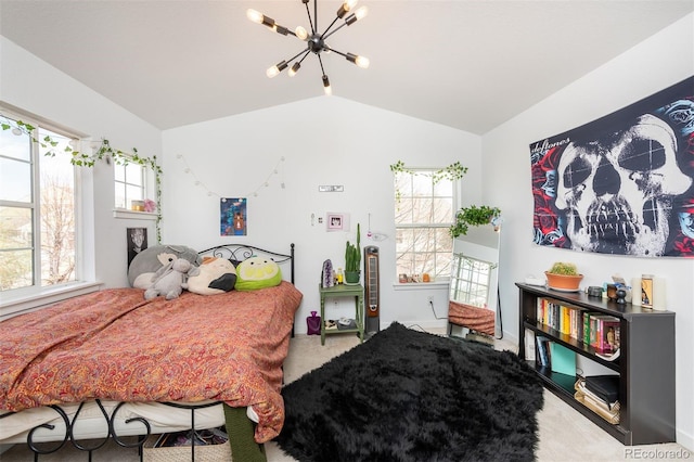 661 Snowberry St, Longmont, CO 80503 - carpeted bedroom with lofted ceiling and a notable chandelier