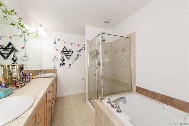 661 Snowberry St, Longmont, CO 80503 - bathroom with a bath, tile patterned floors, a sink, and a stall shower