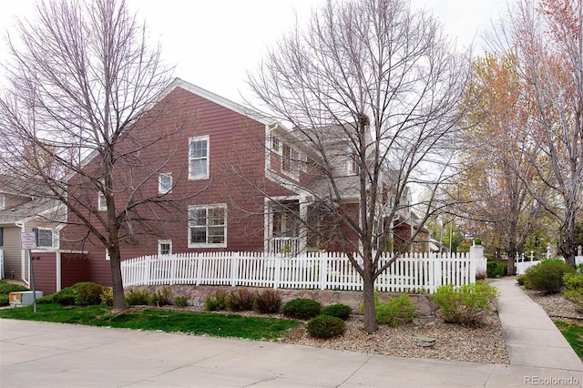 661 Snowberry St, Longmont, CO 80503 - view of front facade with a fenced front yard