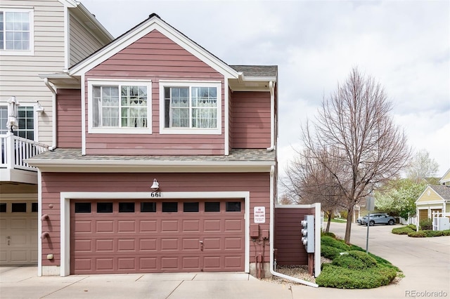 661 Snowberry St, Longmont, CO 80503 - view of front of home with concrete driveway and a garage