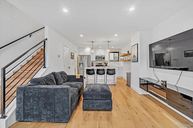 living room with light hardwood / wood-style flooring