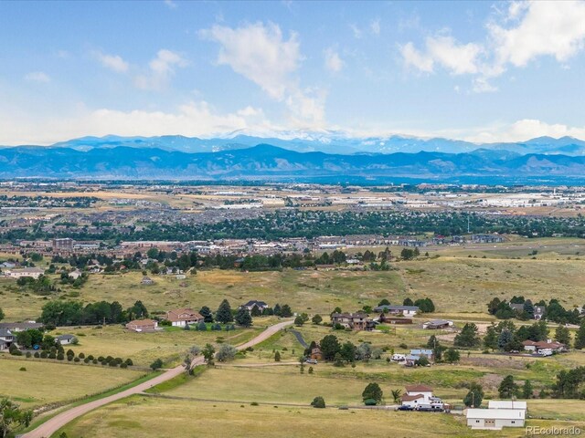 drone / aerial view featuring a rural view and a mountain view