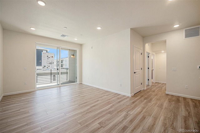 unfurnished room featuring light hardwood / wood-style flooring