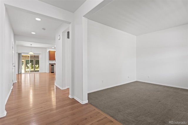 spare room with hardwood / wood-style floors