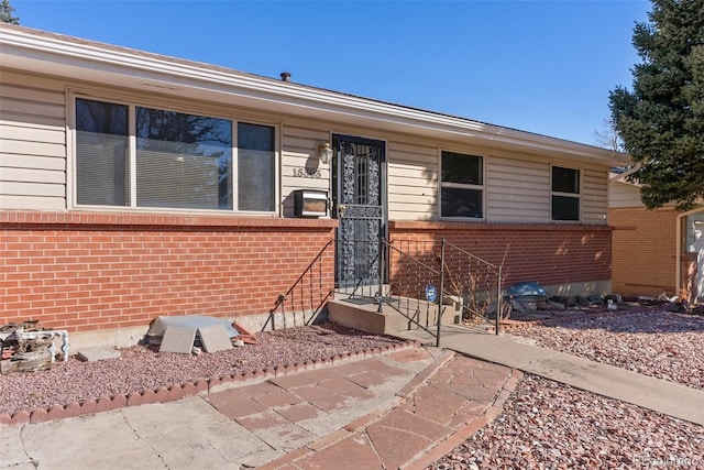 view of front of house with brick siding