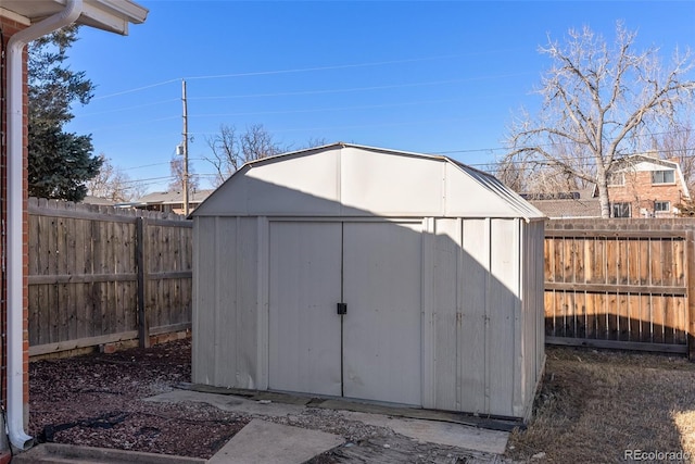 view of shed with a fenced backyard