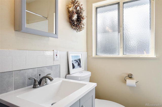 bathroom with toilet and vanity