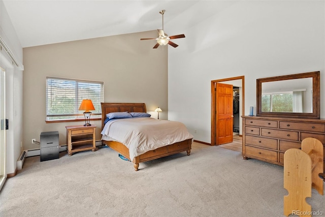 bedroom featuring a closet, a walk in closet, multiple windows, and high vaulted ceiling