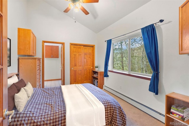 bedroom featuring a baseboard radiator, vaulted ceiling, light colored carpet, and ceiling fan