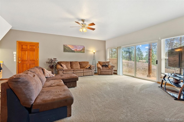 carpeted living room featuring ceiling fan