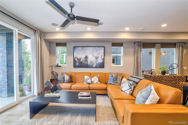 living room featuring light wood-type flooring and ceiling fan