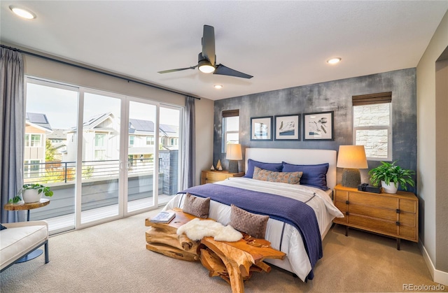 carpeted bedroom featuring access to exterior and ceiling fan