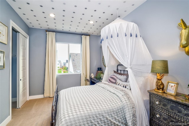 carpeted bedroom featuring a closet