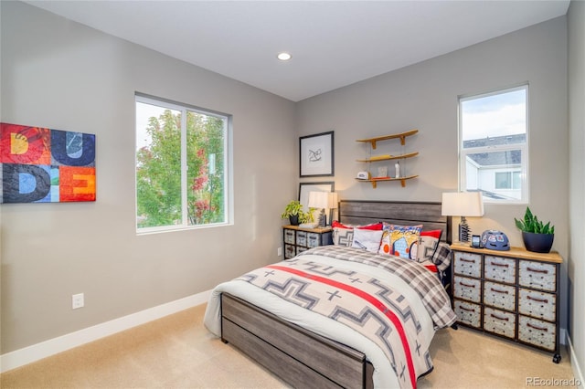 bedroom with light carpet