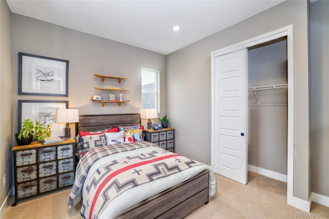 bedroom with light carpet and a closet