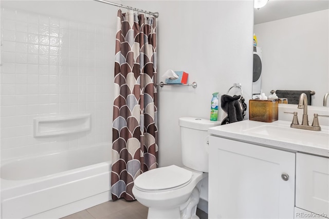 bathroom featuring washer / dryer, vanity, toilet, and shower / bath combo with shower curtain