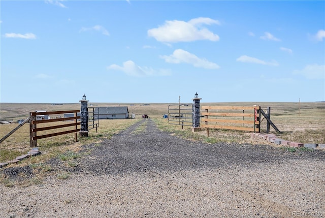 exterior space featuring a rural view and fence