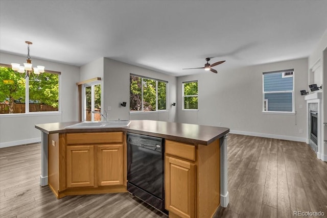 2142 Paint Pony Cir, Castle Rock, CO 80108 - kitchen with dishwasher, dark wood-style floors, ceiling fan, a kitchen island, and healthy amount of natural light