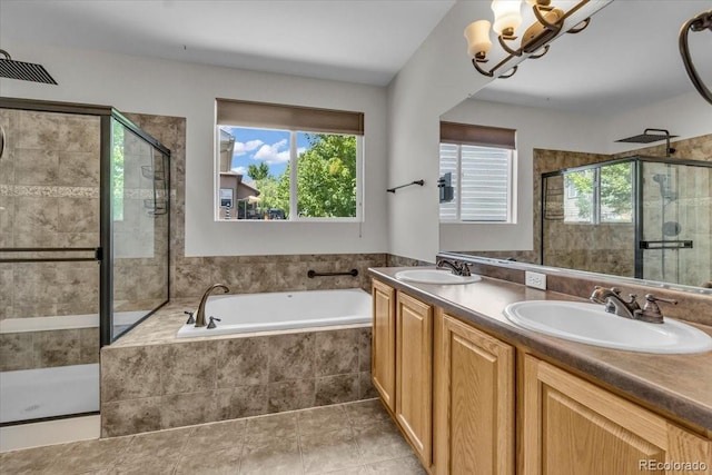 2142 Paint Pony Cir, Castle Rock, CO 80108 - bathroom with a shower stall, a bath, a chandelier, and double vanity