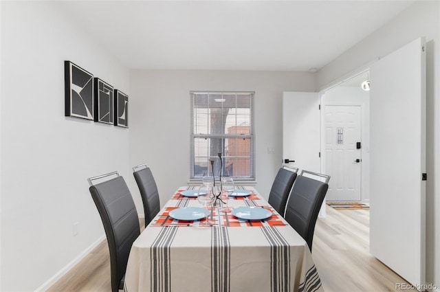 dining room with light wood-type flooring