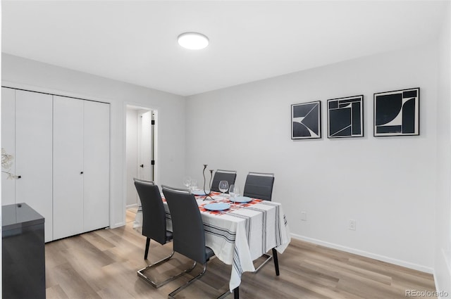 dining room with light hardwood / wood-style flooring